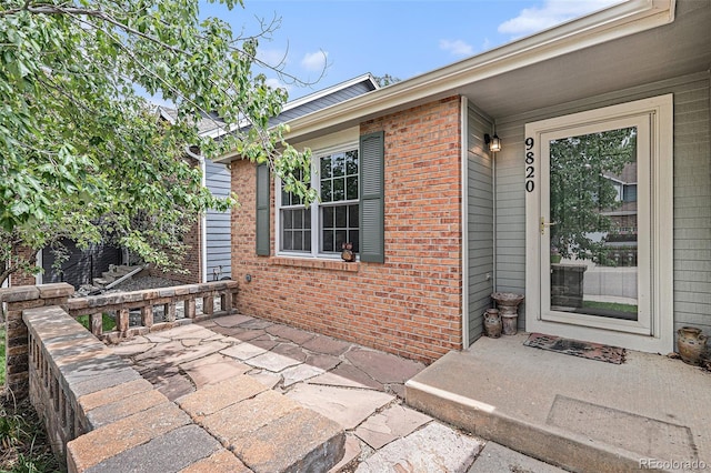 doorway to property with a patio