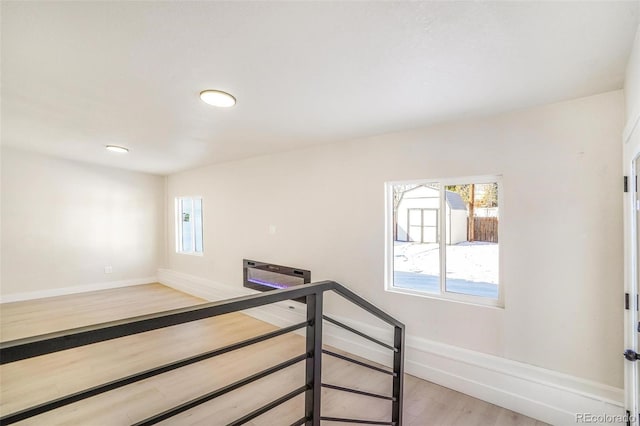 stairway featuring hardwood / wood-style flooring