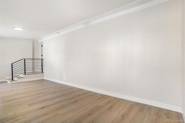 unfurnished room with light hardwood / wood-style flooring