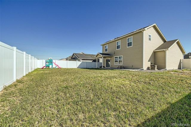 529 Beckwourth, Fort Lupton, CO 80621 - back of property featuring a playground and a fenced backyard