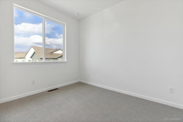 unfurnished room featuring carpet floors