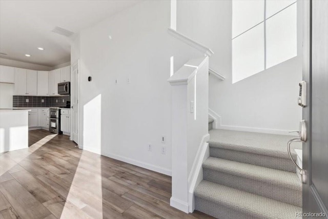 stairway with wood-type flooring