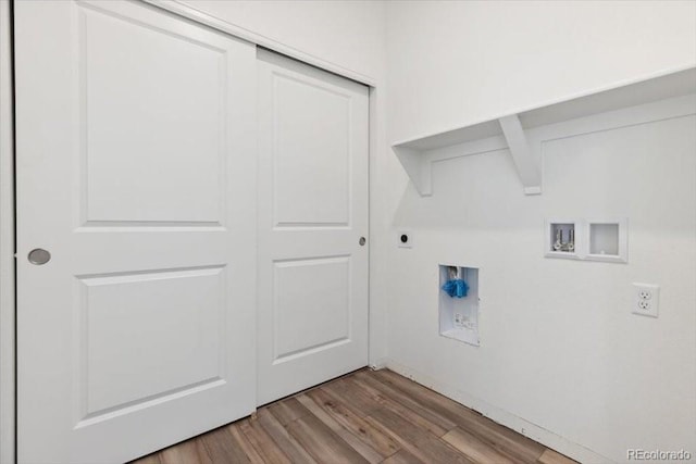 washroom with hookup for an electric dryer, hookup for a washing machine, and light hardwood / wood-style floors