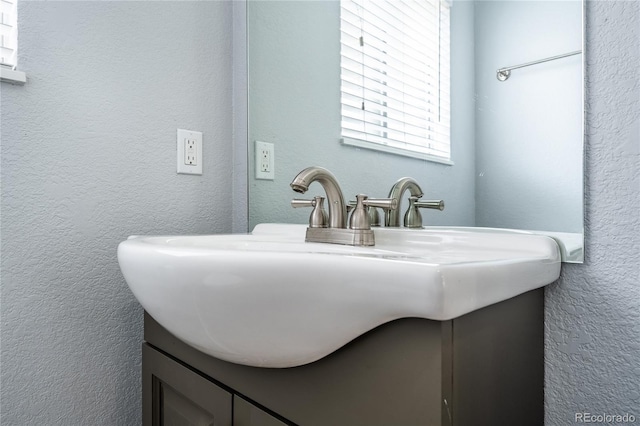 4571 S Memphis St, Aurora, CO 80015 - bathroom featuring a textured wall and vanity