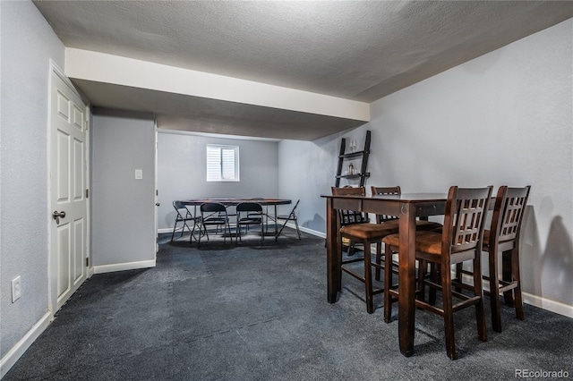 4571 S Memphis St, Aurora, CO 80015 - dining space with carpet floors, baseboards, and a textured ceiling