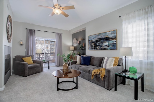 living room with light carpet and ceiling fan