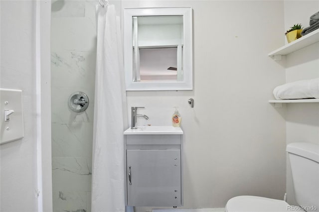 bathroom featuring vanity, a shower with curtain, and toilet