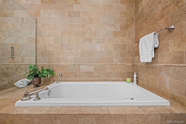 bathroom with tiled bath