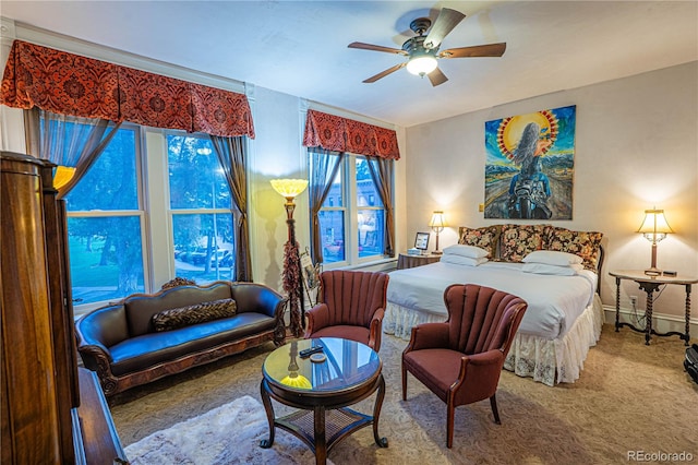 bedroom with ceiling fan and carpet flooring