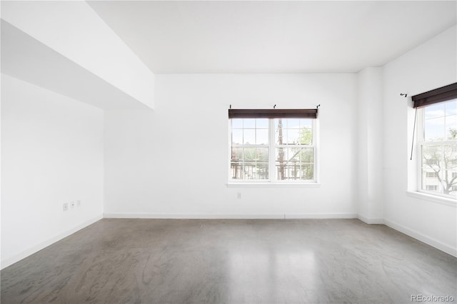 1780 N Washington St Unit 305, Denver, CO 80203 - empty room featuring concrete flooring and baseboards