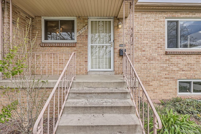 entrance to property with brick siding