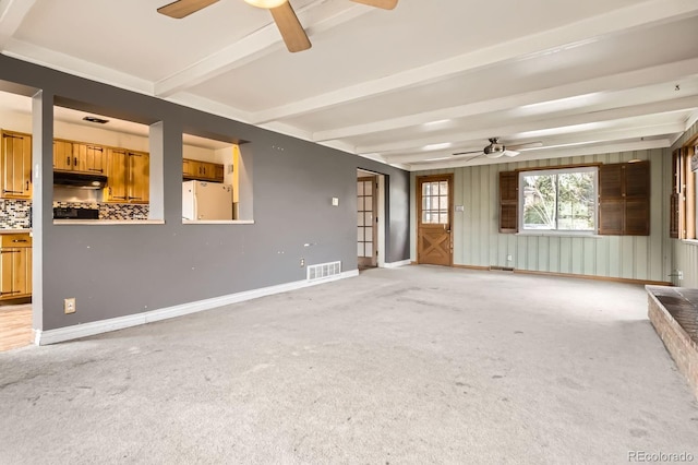 unfurnished living room featuring ceiling fan, light carpet, beam ceiling, and visible vents