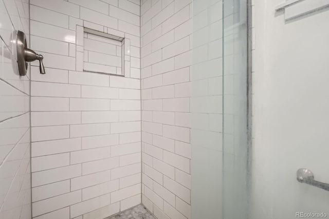 full bathroom featuring a shower stall