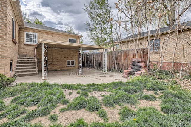 view of yard featuring a patio area and fence