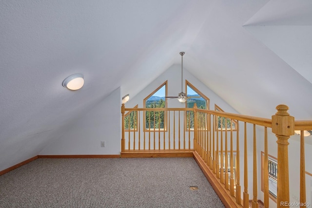 additional living space featuring lofted ceiling and carpet floors