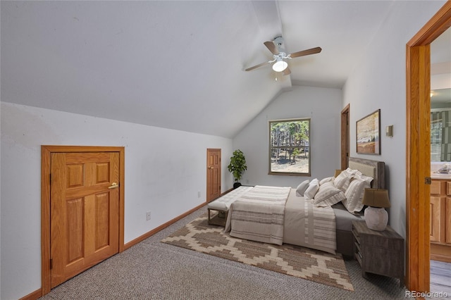 bedroom with connected bathroom, vaulted ceiling, ceiling fan, and carpet