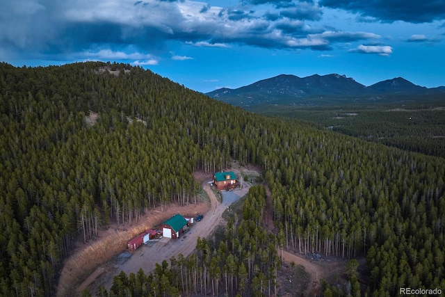 birds eye view of property with a mountain view