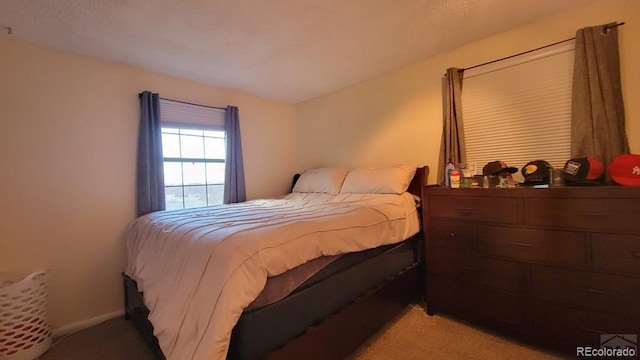 bedroom with light carpet