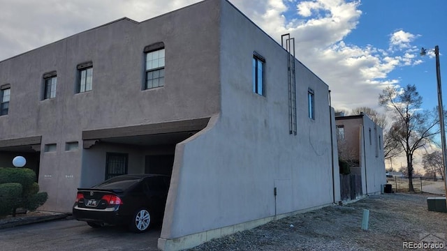 view of side of property with stucco siding