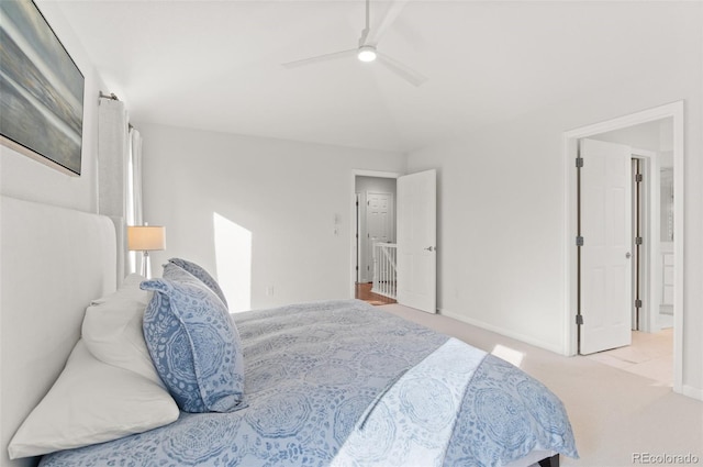 carpeted bedroom featuring baseboards and a ceiling fan