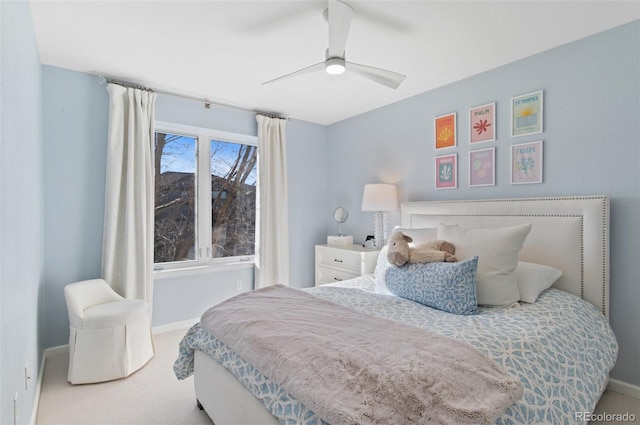 bedroom with ceiling fan, carpet, and baseboards