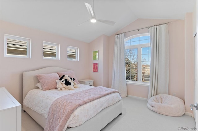 carpeted bedroom featuring baseboards, vaulted ceiling, and a ceiling fan