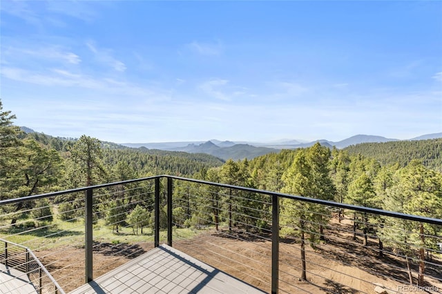 13415 S Resort Dr, Conifer, CO 80433 - balcony featuring a view of trees and a mountain view
