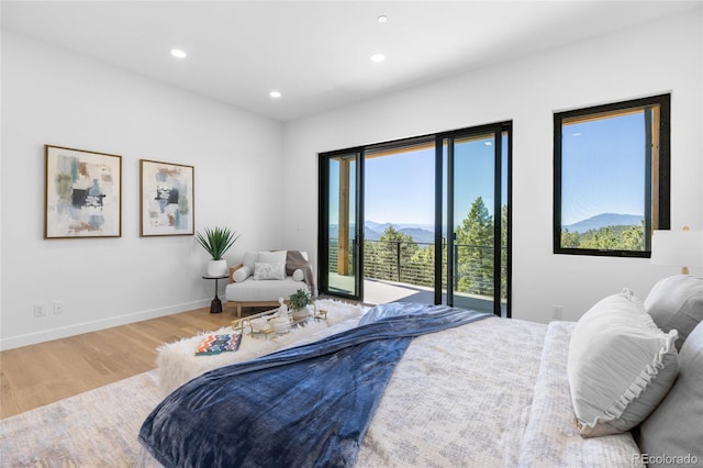 13415 S Resort Dr, Conifer, CO 80433 - bedroom featuring access to exterior, wood finished floors, recessed lighting, and a mountain view