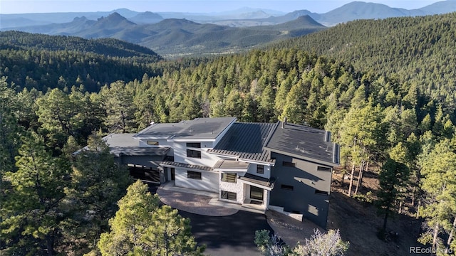 13415 S Resort Dr, Conifer, CO 80433 - view from above of property featuring a heavily wooded area and mountains
