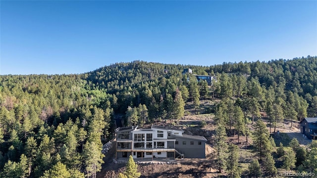 13415 S Resort Dr, Conifer, CO 80433 - view from above of property with a heavily wooded area