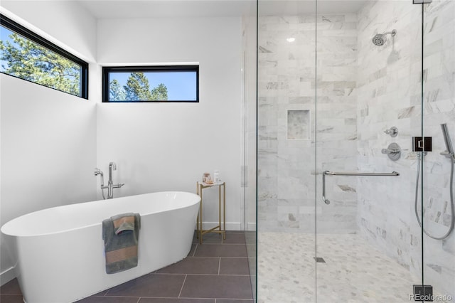 13415 S Resort Dr, Conifer, CO 80433 - bathroom with a shower stall, a freestanding bath, and tile patterned floors