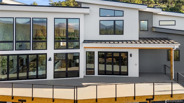 13415 S Resort Dr, Conifer, CO 80433 - rear view of property with a standing seam roof and a metal roof
