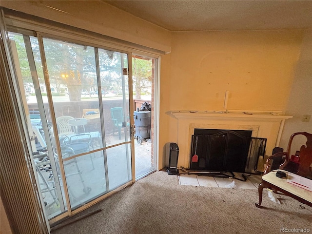 carpeted living room with a fireplace