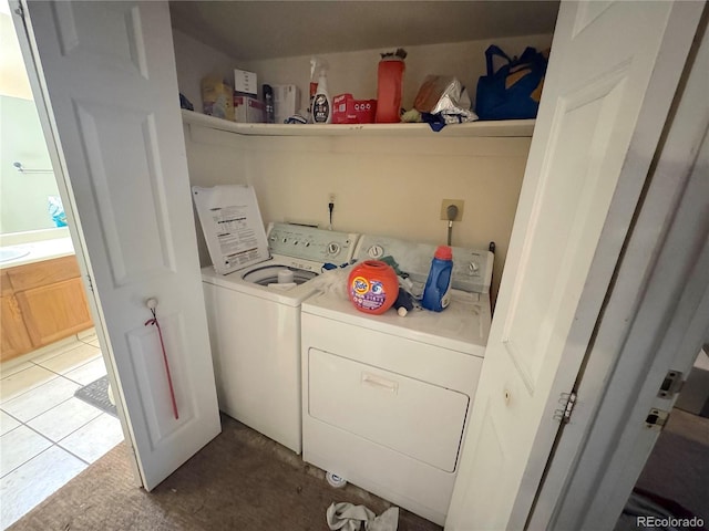 washroom with washer and dryer and laundry area