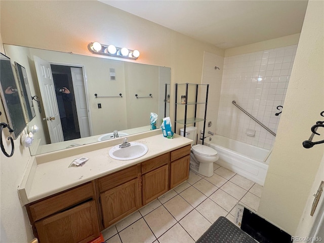 full bathroom featuring toilet, tile patterned floors, vanity, and bathing tub / shower combination