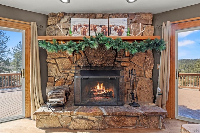 interior details featuring a stone fireplace