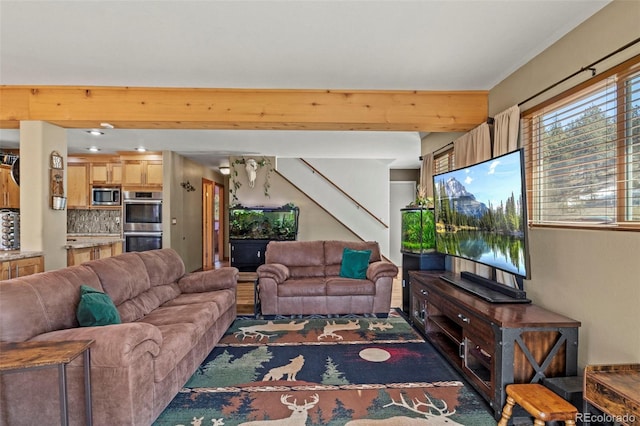 living area featuring stairs