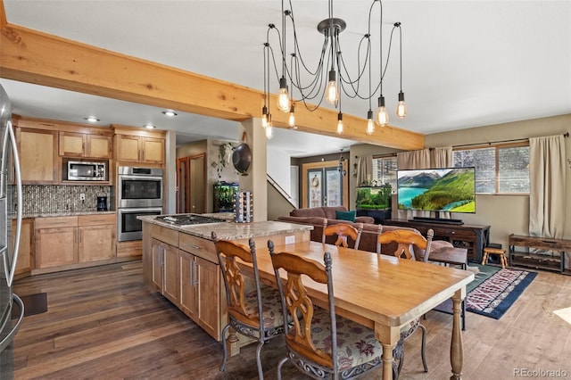 dining area featuring dark wood finished floors, stairway, beamed ceiling, and a notable chandelier