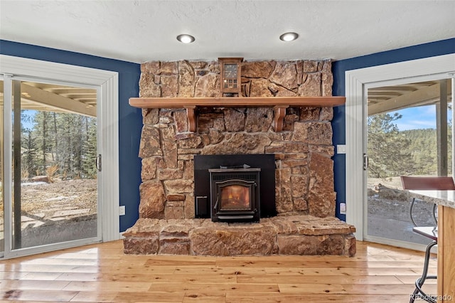 interior details with a textured ceiling and wood finished floors