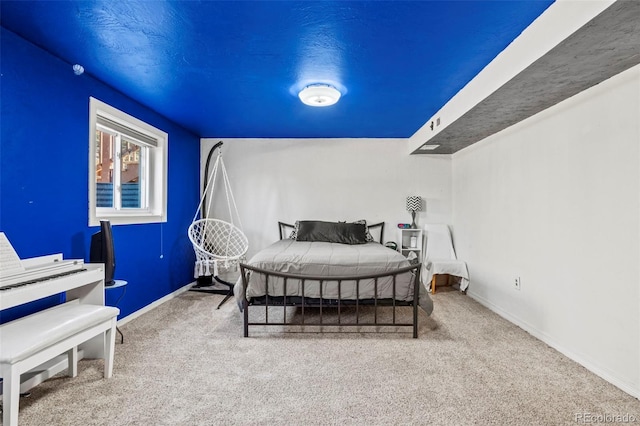 bedroom with carpet flooring and baseboards