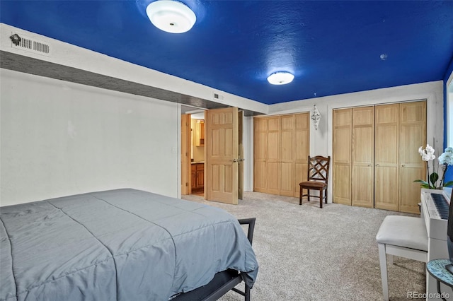 bedroom with visible vents and carpet floors