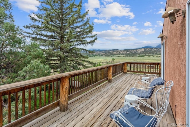 deck with a mountain view and a rural view