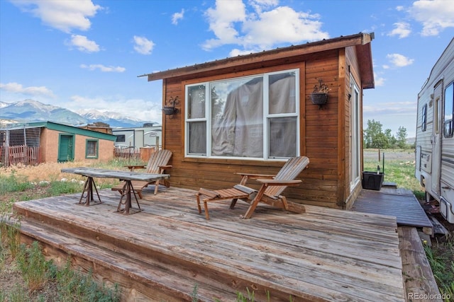 wooden terrace with a mountain view