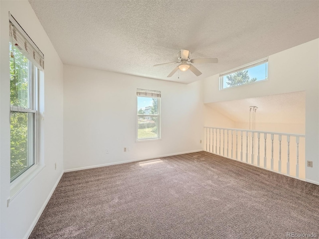 unfurnished room featuring ceiling fan, plenty of natural light, and carpet floors