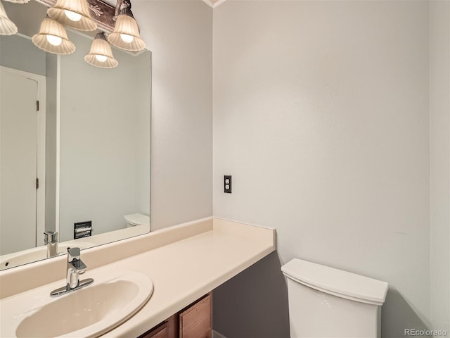 bathroom with vanity and toilet