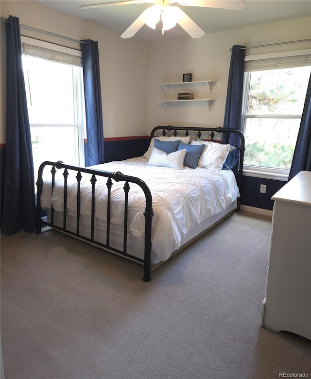 carpeted bedroom featuring ceiling fan