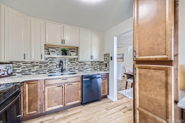 kitchen with electric range, a sink, light countertops, backsplash, and dishwasher