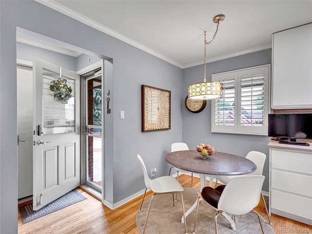 3481 S Race St, Englewood, CO 80113 - dining room with light wood-type flooring and ornamental molding