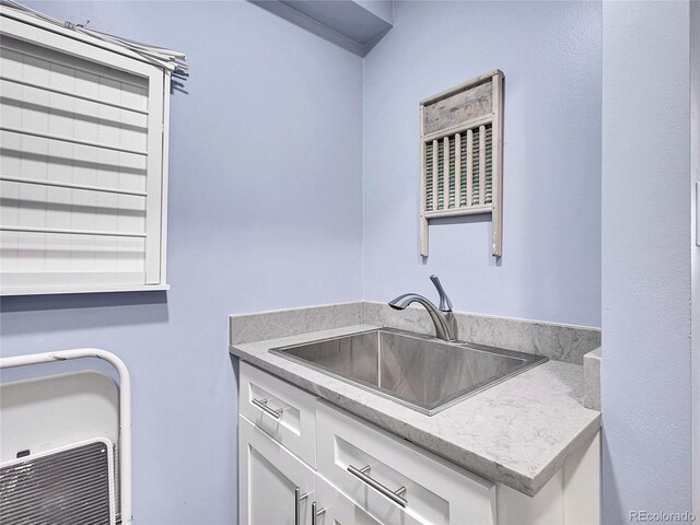 3481 S Race St, Englewood, CO 80113 - laundry area with a sink and heating unit