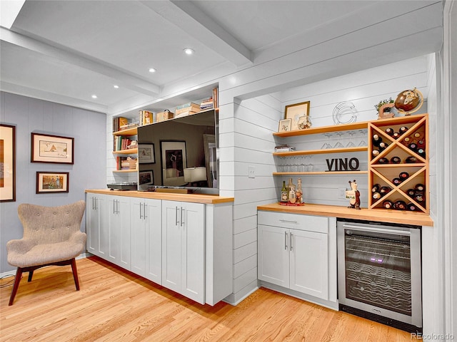 3481 S Race St, Englewood, CO 80113 - indoor dry bar with beverage cooler, beamed ceiling, light wood finished floors, wooden walls, and recessed lighting